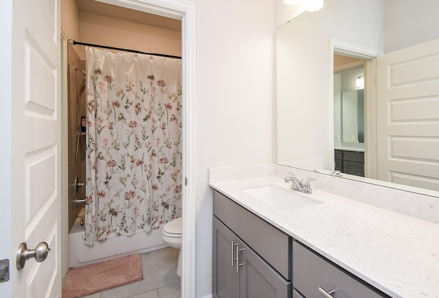 bathroom with shower / bath combo, tile patterned flooring, vanity, and toilet