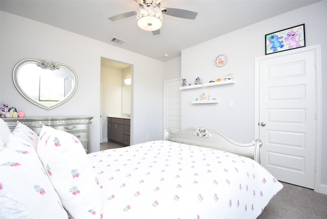 bedroom featuring a ceiling fan, ensuite bathroom, visible vents, and carpet