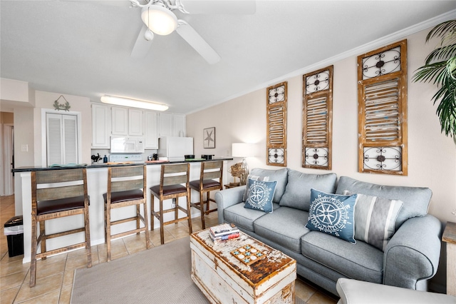 9520 Seawall Blvd Unit 226, Galveston, TX 77554 - living area with a ceiling fan, ornamental molding, and light tile patterned floors