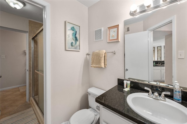9520 Seawall Blvd Unit 226, Galveston, TX 77554 - full bathroom featuring vanity, toilet, a stall shower, and tile patterned floors
