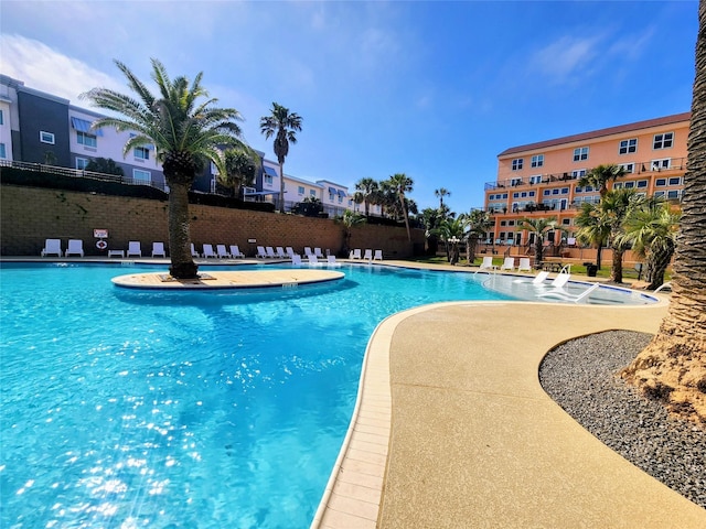 9520 Seawall Blvd Unit 226, Galveston, TX 77554 - pool with a patio area and fence