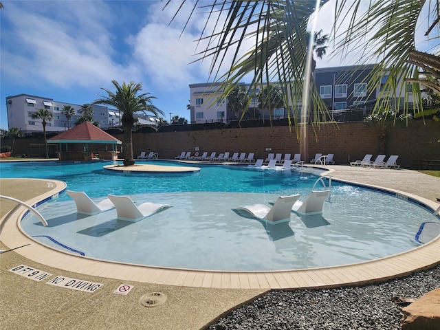 9520 Seawall Blvd Unit 226, Galveston, TX 77554 - community pool featuring a gazebo, a patio area, and fence