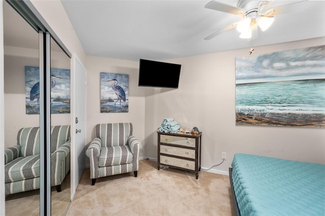 9520 Seawall Blvd Unit 226, Galveston, TX 77554 - bedroom with baseboards, a ceiling fan, and light colored carpet