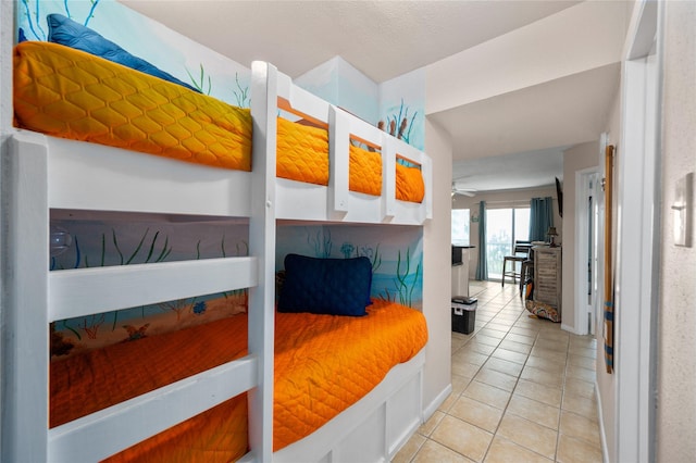 9520 Seawall Blvd Unit 226, Galveston, TX 77554 - bedroom featuring light tile patterned flooring