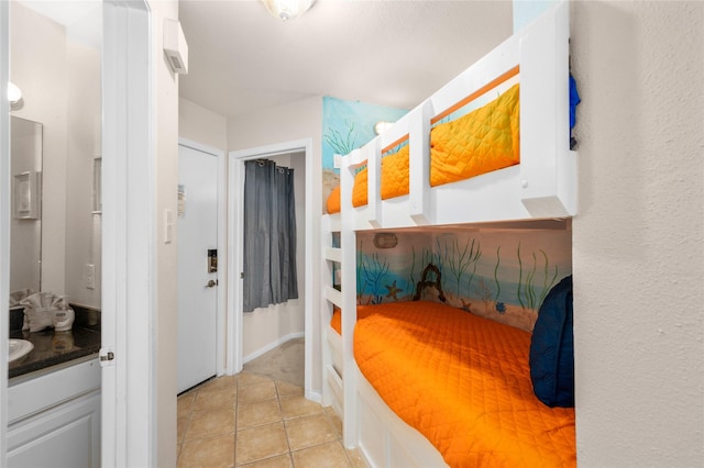 9520 Seawall Blvd Unit 226, Galveston, TX 77554 - unfurnished bedroom featuring light tile patterned floors