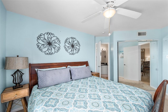 9520 Seawall Blvd Unit 226, Galveston, TX 77554 - bedroom featuring ceiling fan, visible vents, and ensuite bathroom