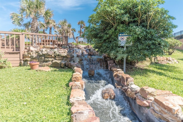 9520 Seawall Blvd Unit 226, Galveston, TX 77554 - view of yard featuring a garden pond