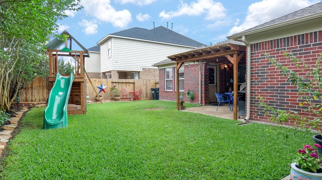 exterior space with a fenced backyard, a pergola, a patio, and a playground
