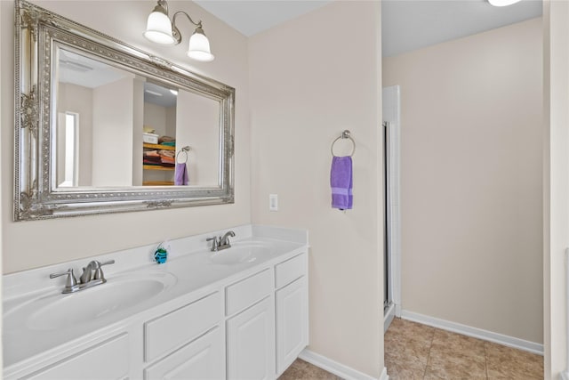 17031 Pelorus Way, Crosby, TX 77532 - full bathroom with baseboards, double vanity, a shower with door, and a sink