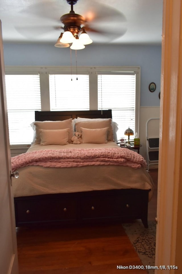bedroom featuring a ceiling fan and wood finished floors