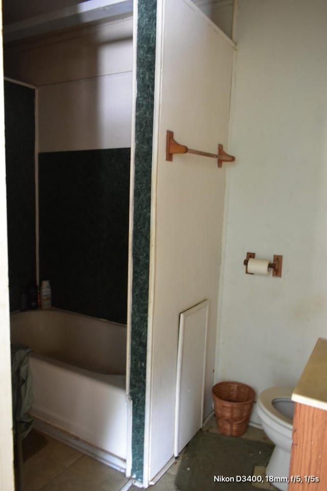 full bathroom featuring tile patterned floors, vanity, a tub, a shower, and toilet