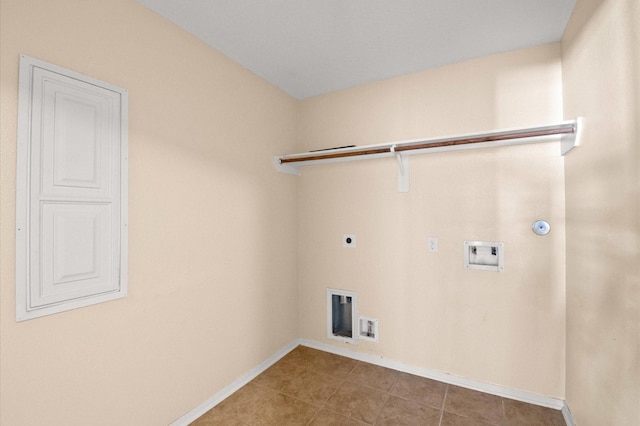 clothes washing area with hookup for a washing machine, hookup for an electric dryer, baseboards, gas dryer hookup, and laundry area