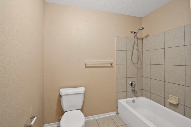 bathroom with baseboards, toilet, tile patterned flooring, and bathing tub / shower combination