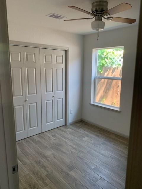 4533 Rosemont St, Houston, TX 77051 - unfurnished bedroom with ceiling fan, wood finished floors, visible vents, and a closet