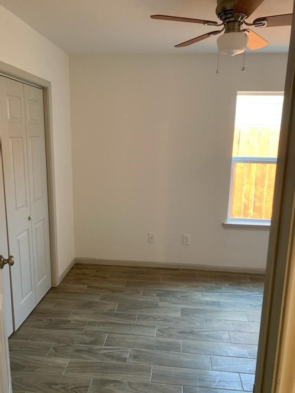 4533 Rosemont St, Houston, TX 77051 - unfurnished bedroom with a closet, wood finish floors, and a ceiling fan