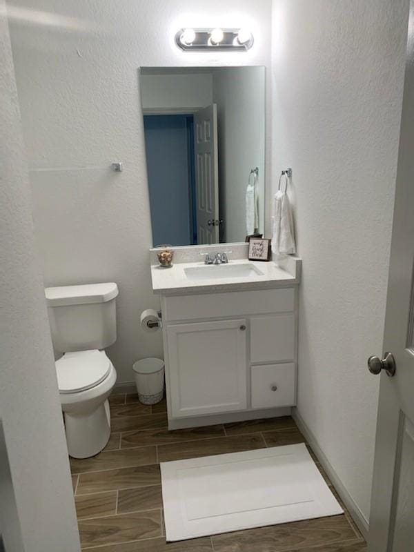 4533 Rosemont St, Houston, TX 77051 - bathroom featuring wood finish floors, toilet, and vanity