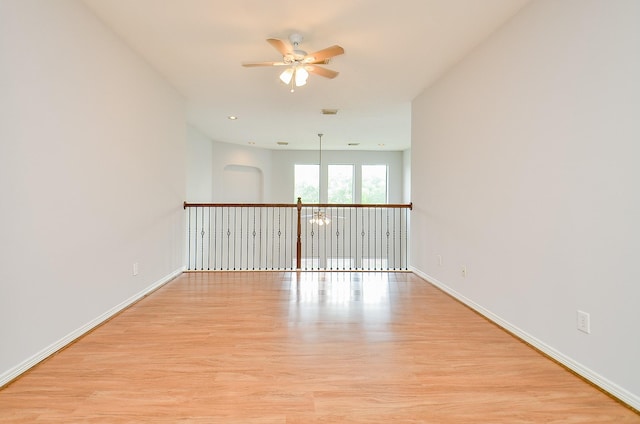 3911 Fallsbrook Ct, Sugar Land, TX 77479 - unfurnished room featuring baseboards, wood finished floors, and ceiling fan