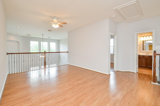 3911 Fallsbrook Ct, Sugar Land, TX 77479 - empty room featuring recessed lighting, light wood finished floors, a ceiling fan, baseboards, and attic access