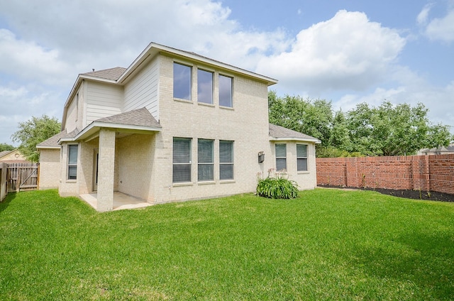 3911 Fallsbrook Ct, Sugar Land, TX 77479 - back of house featuring a fenced backyard, a lawn, and a shingled roof