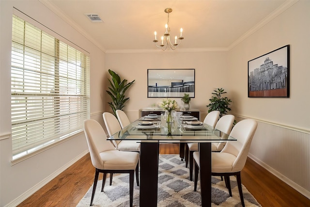 3911 Fallsbrook Ct, Sugar Land, TX 77479 - dining room featuring plenty of natural light, wood finished floors, visible vents, and an inviting chandelier