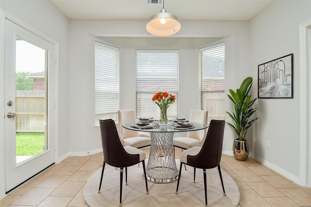 3911 Fallsbrook Ct, Sugar Land, TX 77479 - dining room featuring visible vents, baseboards, and light tile patterned floors