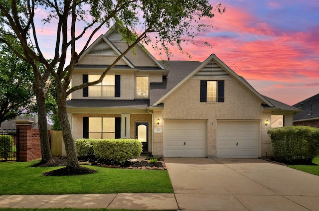 3911 Fallsbrook Ct, Sugar Land, TX 77479 - view of front of property featuring driveway, an attached garage, fence, a front yard, and brick siding