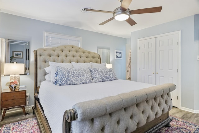 224 Clear Lake Rd, Clear Lake Shores, TX 77565 - bedroom with baseboards, a ceiling fan, wood finished floors, and a closet