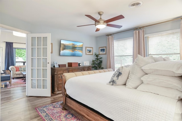 224 Clear Lake Rd, Clear Lake Shores, TX 77565 - bedroom with ceiling fan, wood finished floors, and visible vents