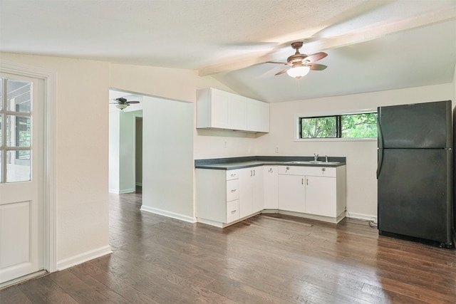 224 Clear Lake Rd, Clear Lake Shores, TX 77565 - kitchen with freestanding refrigerator, dark countertops, vaulted ceiling with beams, and ceiling fan