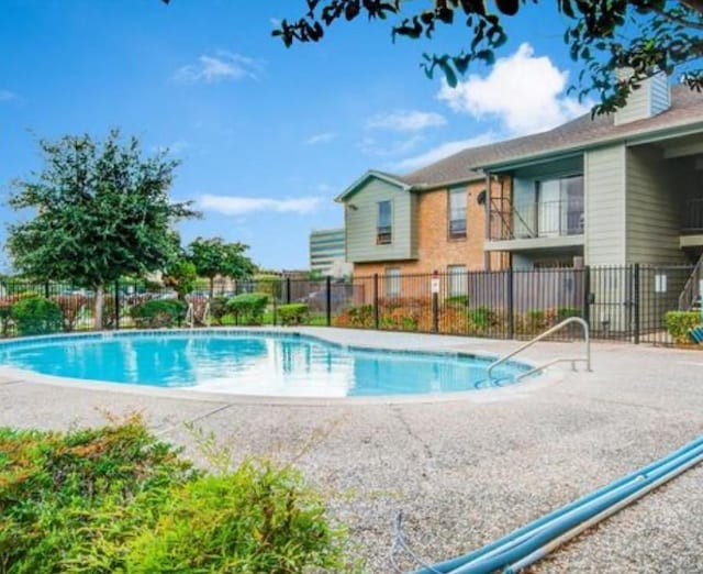 9350 Country Creek Dr Unit 56, Houston, TX 77036 - community pool with fence and a patio