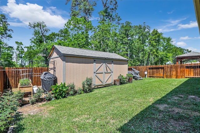 22086 Sun Haven Ln, Porter, TX 77365 - view of yard featuring a fenced backyard, a storage unit, and an outbuilding