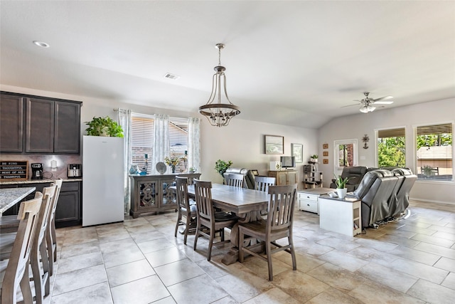 22086 Sun Haven Ln, Porter, TX 77365 - dining room featuring vaulted ceiling, visible vents, and ceiling fan with notable chandelier