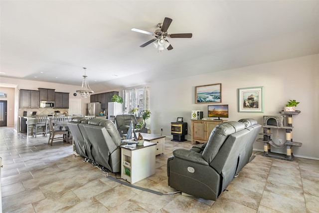 22086 Sun Haven Ln, Porter, TX 77365 - living area with stone finish flooring, a ceiling fan, and a wood stove