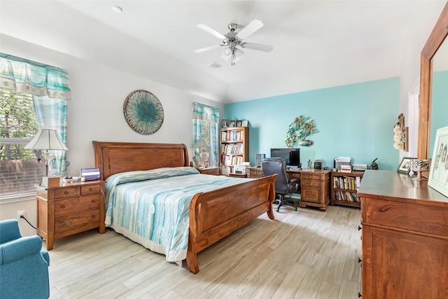 22086 Sun Haven Ln, Porter, TX 77365 - bedroom featuring vaulted ceiling, multiple windows, and light wood-type flooring