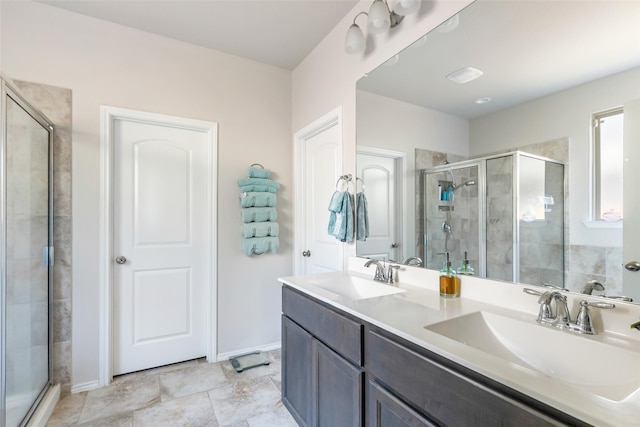 22086 Sun Haven Ln, Porter, TX 77365 - full bathroom featuring baseboards, a sink, double vanity, and a stall shower