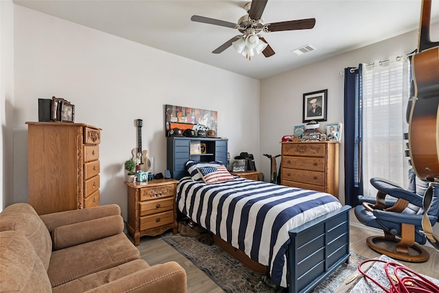 22086 Sun Haven Ln, Porter, TX 77365 - bedroom featuring light wood-style flooring, visible vents, and a ceiling fan