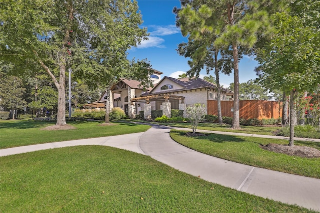 22086 Sun Haven Ln, Porter, TX 77365 - view of front of home featuring a front lawn and fence