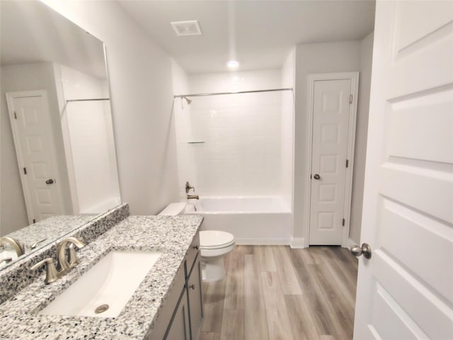 2 Gemstone Ct, Angleton, TX 77515 - bathroom featuring toilet, wood finished floors, vanity, and shower / washtub combination