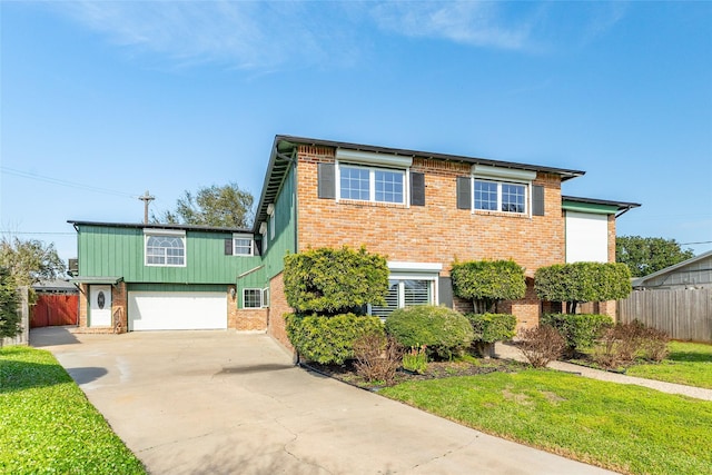 2610 Gerol Ct, Galveston, TX 77551 - view of front of home with concrete driveway, brick siding, fence, and a garage