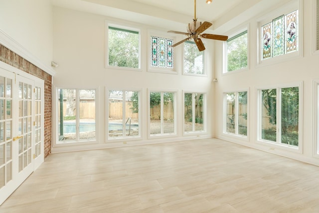 2610 Gerol Ct, Galveston, TX 77551 - unfurnished sunroom with a high ceiling, a wealth of natural light, and french doors