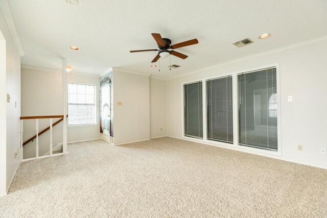 2610 Gerol Ct, Galveston, TX 77551 - empty room with ceiling fan, visible vents, carpet flooring, and crown molding