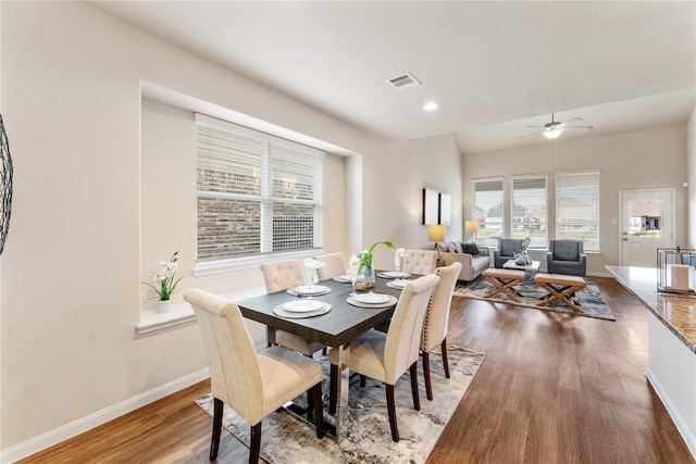 dining space with a ceiling fan, wood finished floors, baseboards, visible vents, and recessed lighting