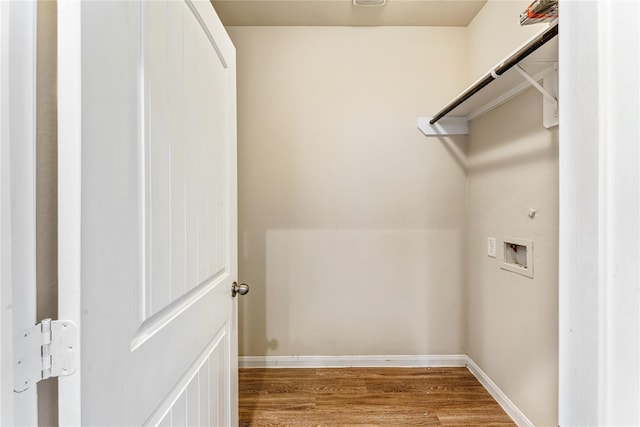 washroom featuring wood finished floors, laundry area, baseboards, hookup for a gas dryer, and washer hookup