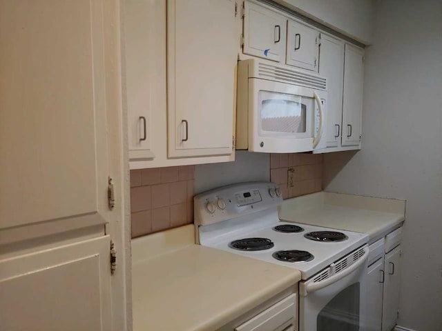 10555 Turtlewood Ct Unit 607, Houston, TX 77072 - kitchen featuring white cabinets, tasteful backsplash, white appliances, and light countertops