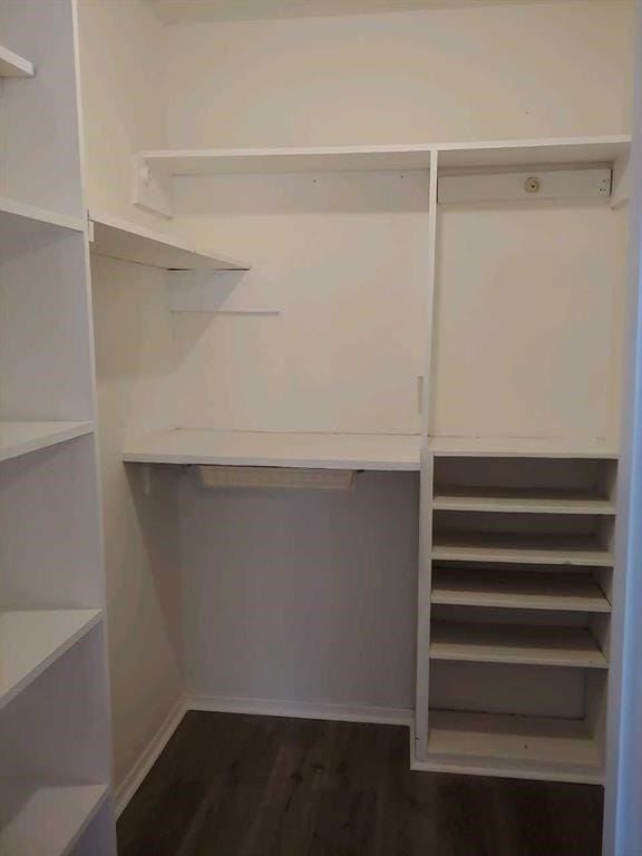 10555 Turtlewood Ct Unit 607, Houston, TX 77072 - walk in closet featuring dark wood finished floors