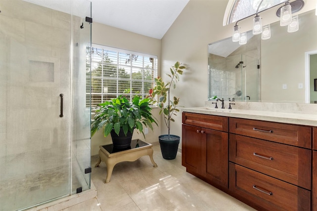 bathroom featuring high vaulted ceiling, vanity, and a stall shower