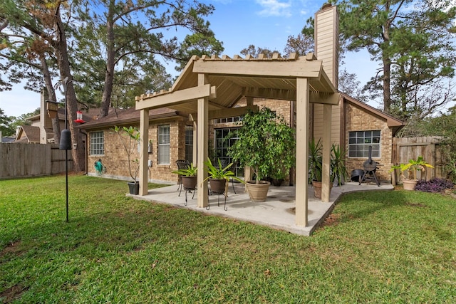 view of yard with fence and a patio area