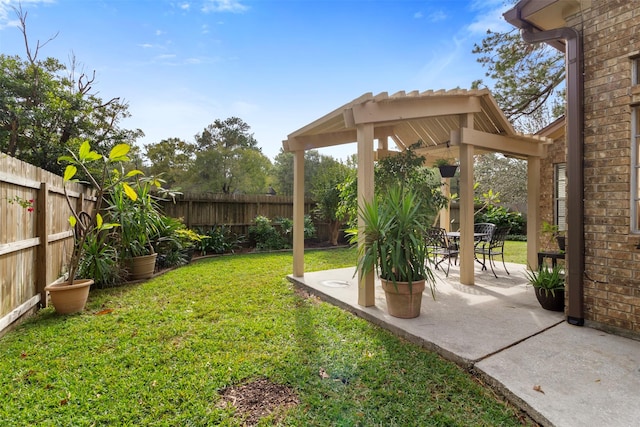 view of yard featuring a patio area, a fenced backyard, and a gazebo