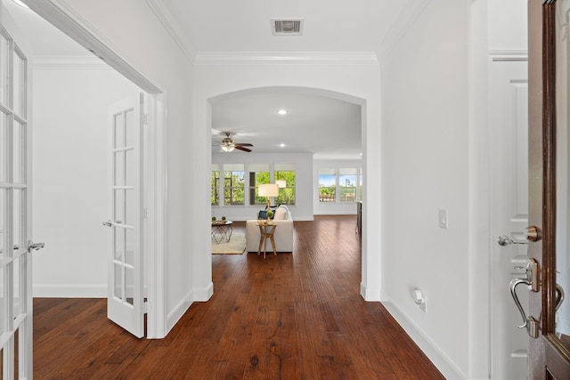 2939 Persimmon Grv, Richmond, TX 77469 - foyer entrance featuring arched walkways, dark wood-style floors, crown molding, baseboards, and a ceiling fan