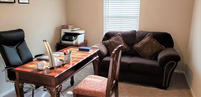 carpeted home office with baseboards